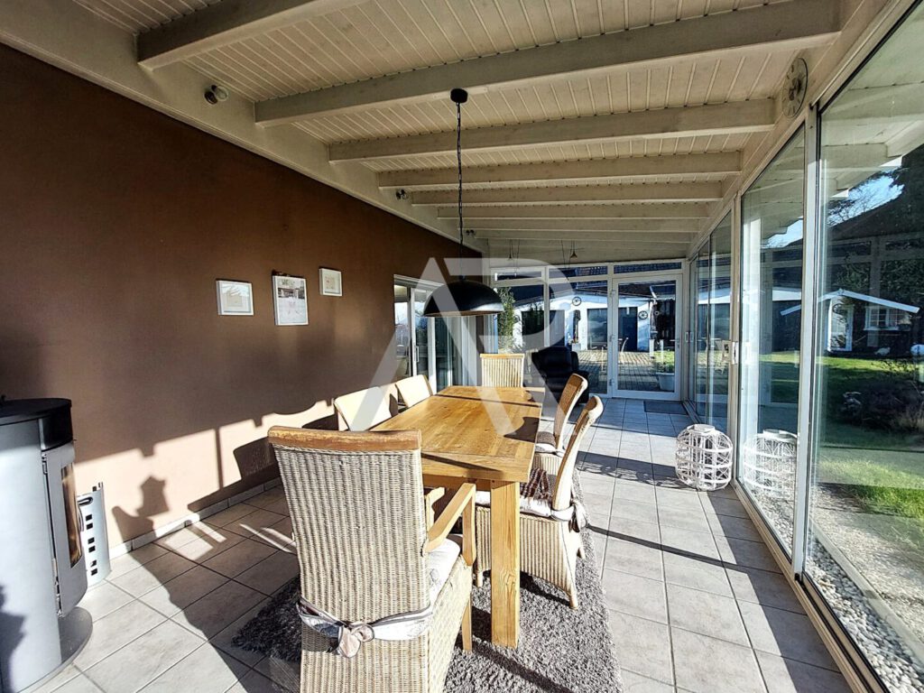 Wintergarten mit Kaminofen